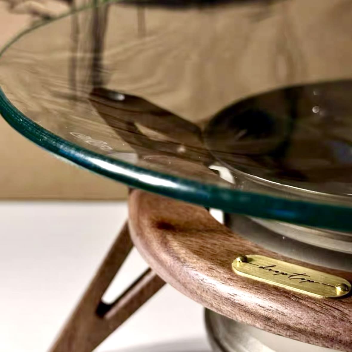Precision-machined 7075 aluminum car rim detail on key holder tray for automotive enthusiasts
