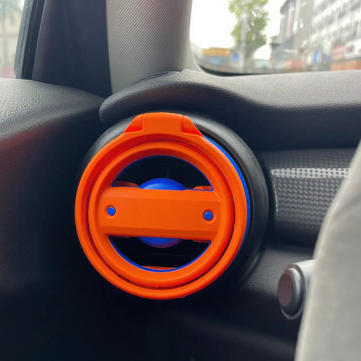 Cup holder installed on passenger side of Mini Cooper R61