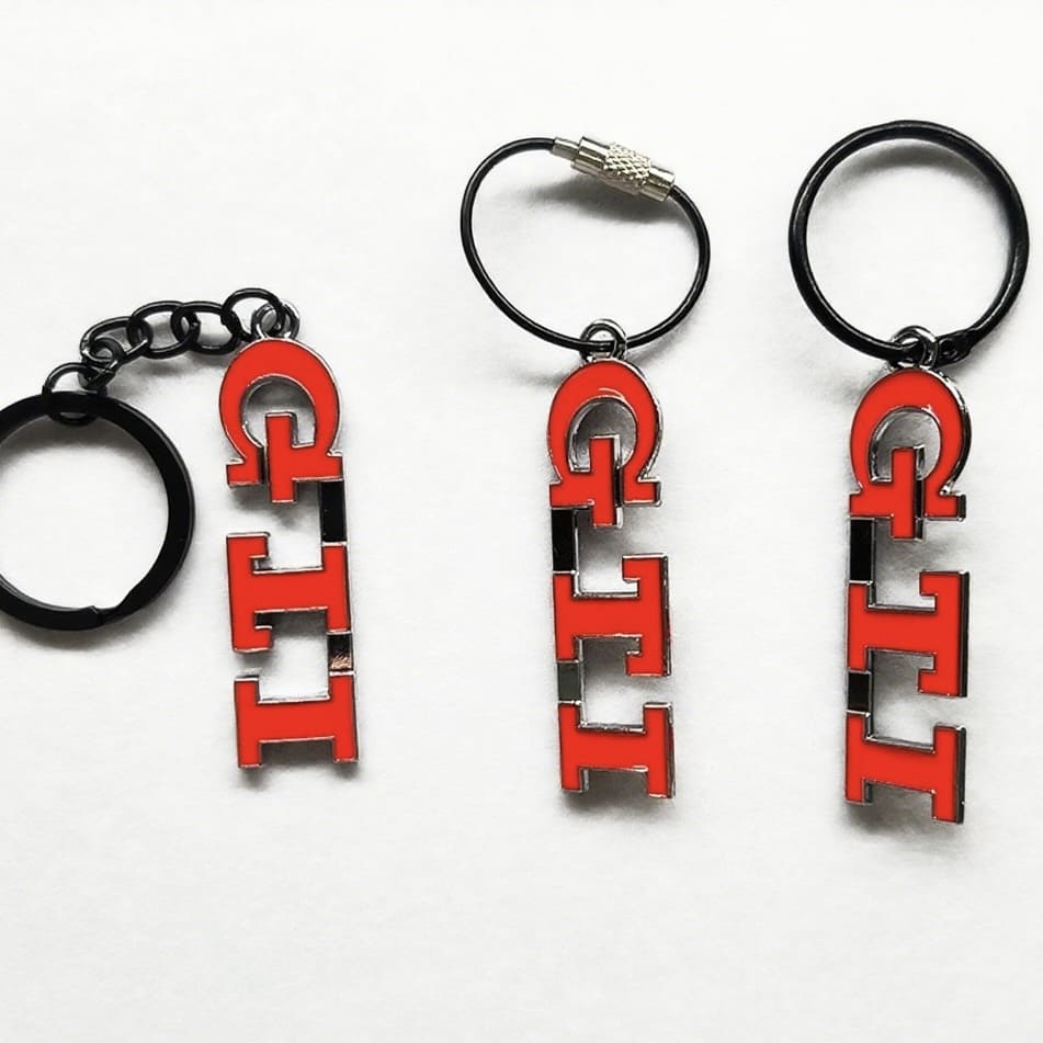 Detailed close-up of the Volkswagen Golf GTI keychain with hand-drawn artwork of all GTI generations, ideal for VW enthusiasts.