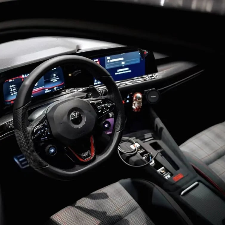 Close-up of Golf MK7 gear shift panel cover in Alcantara with red stitching