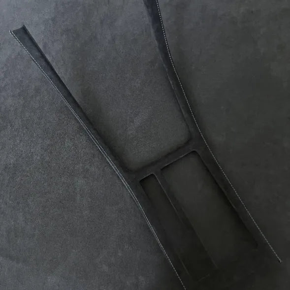 Precision-crafted gear shift panel cover for Golf R with motorsport-inspired blue stitching.