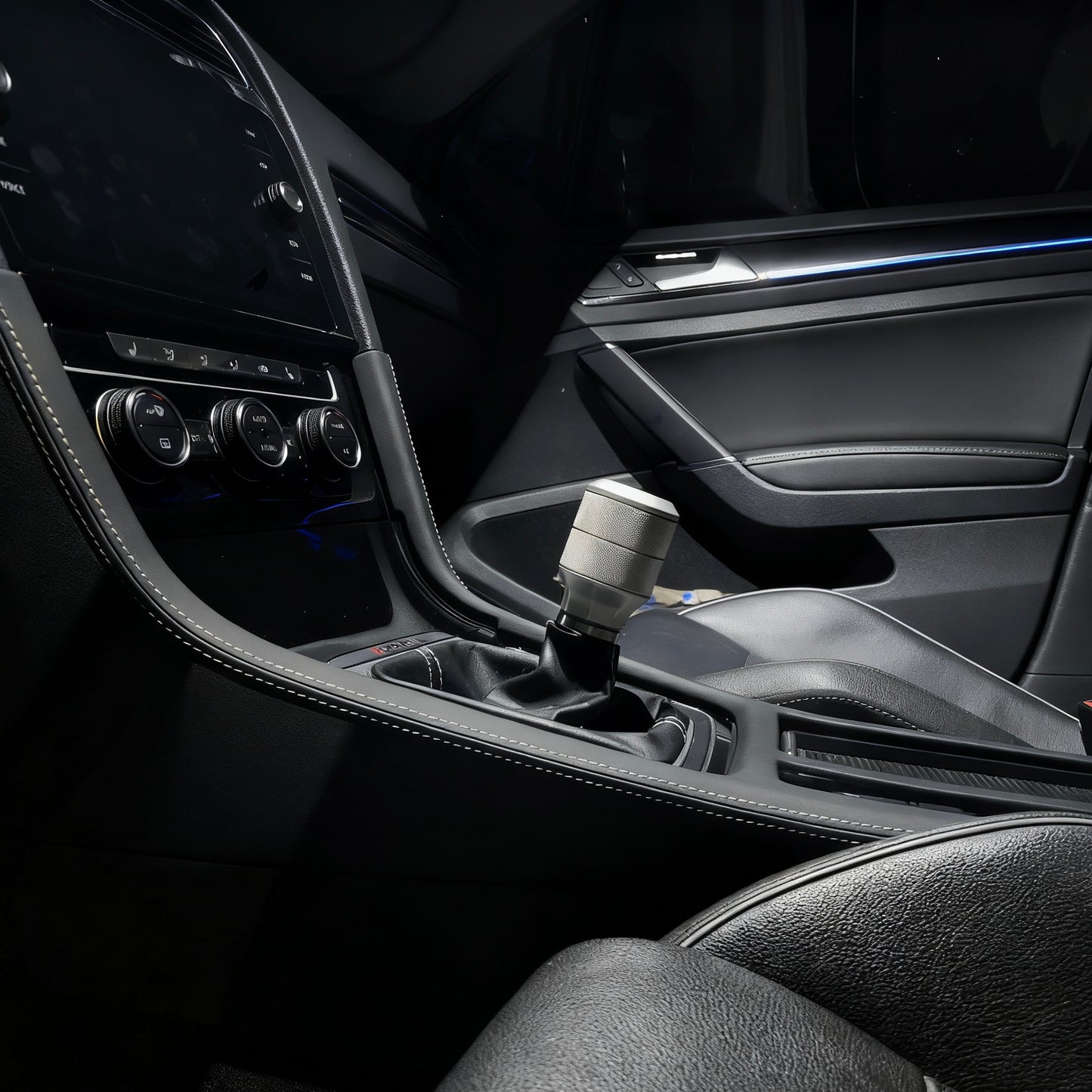 Golf R MK7.5 central console showing precise fitment of the custom Alcantara gear shift panel cover for automatic and manual e-brake models.