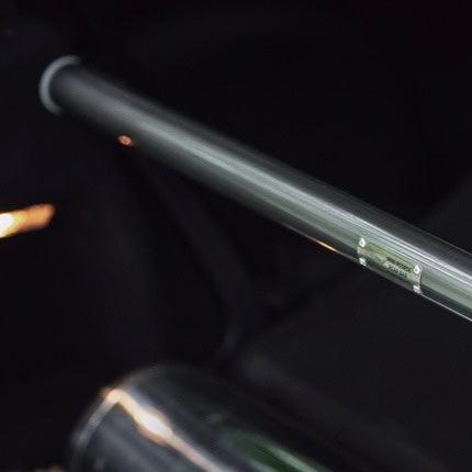 Top view of the rear strut brace installed in a MINI Cooper, emphasizing its TIG-welded build quality.