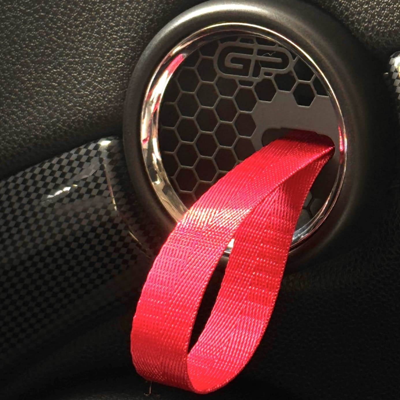 Pair of red GP-style beehive handle pull RS straps ready for installation in MINI Cooper R59.