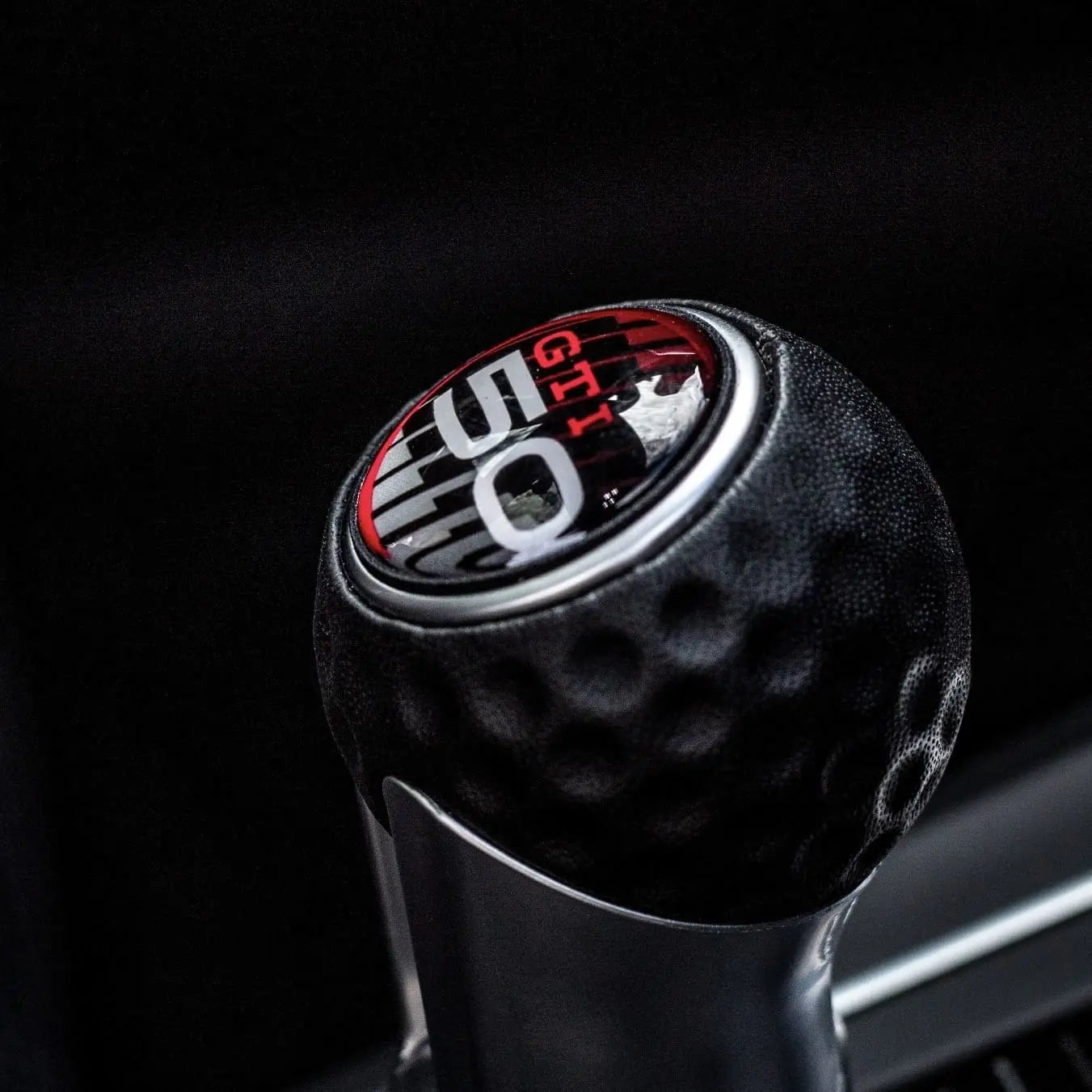 Close-up of VW Golf GTI MK8 gear knob extension installed with sport interior styling