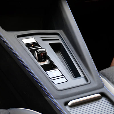 Front view of VW Golf MK7-MK8.5 Central Control Gear Shift Panel Cover in Alcantara or Leather, GTI red stitching and R blue stitching options, premium interior upgrade
