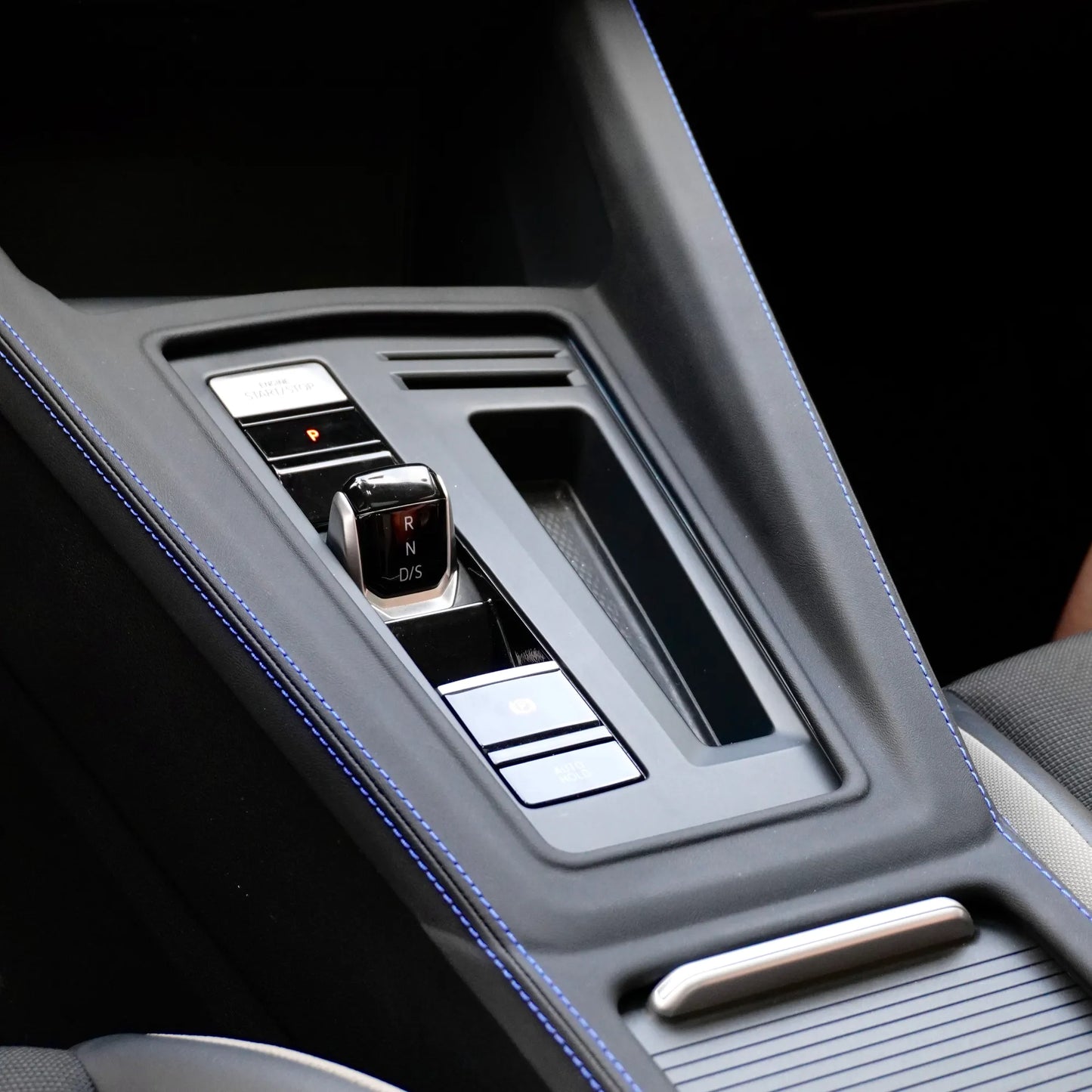 Front view of VW Golf MK7-MK8.5 Central Control Gear Shift Panel Cover in Alcantara or Leather, GTI red stitching and R blue stitching options, premium interior upgrade