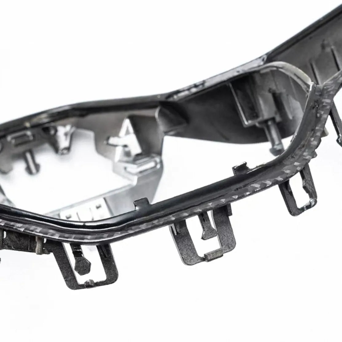 Motorsport-inspired carbon fiber steering wheel trim for VW Golf MK8, GTI, and R, providing premium look and tactile, durable finish.