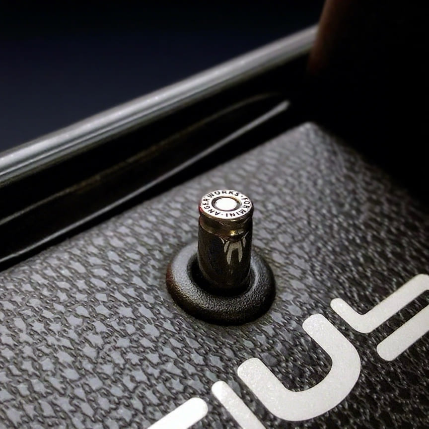 Bullet-inspired metal door lock pin – custom aftermarket part for MINI Cooper R-Series interiors