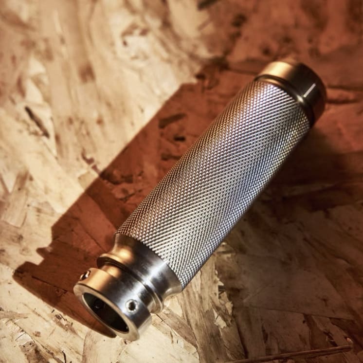 Close-up of textured aluminum handbrake lever grip — fits MINI Cooper R50, R53, R56, and Countryman