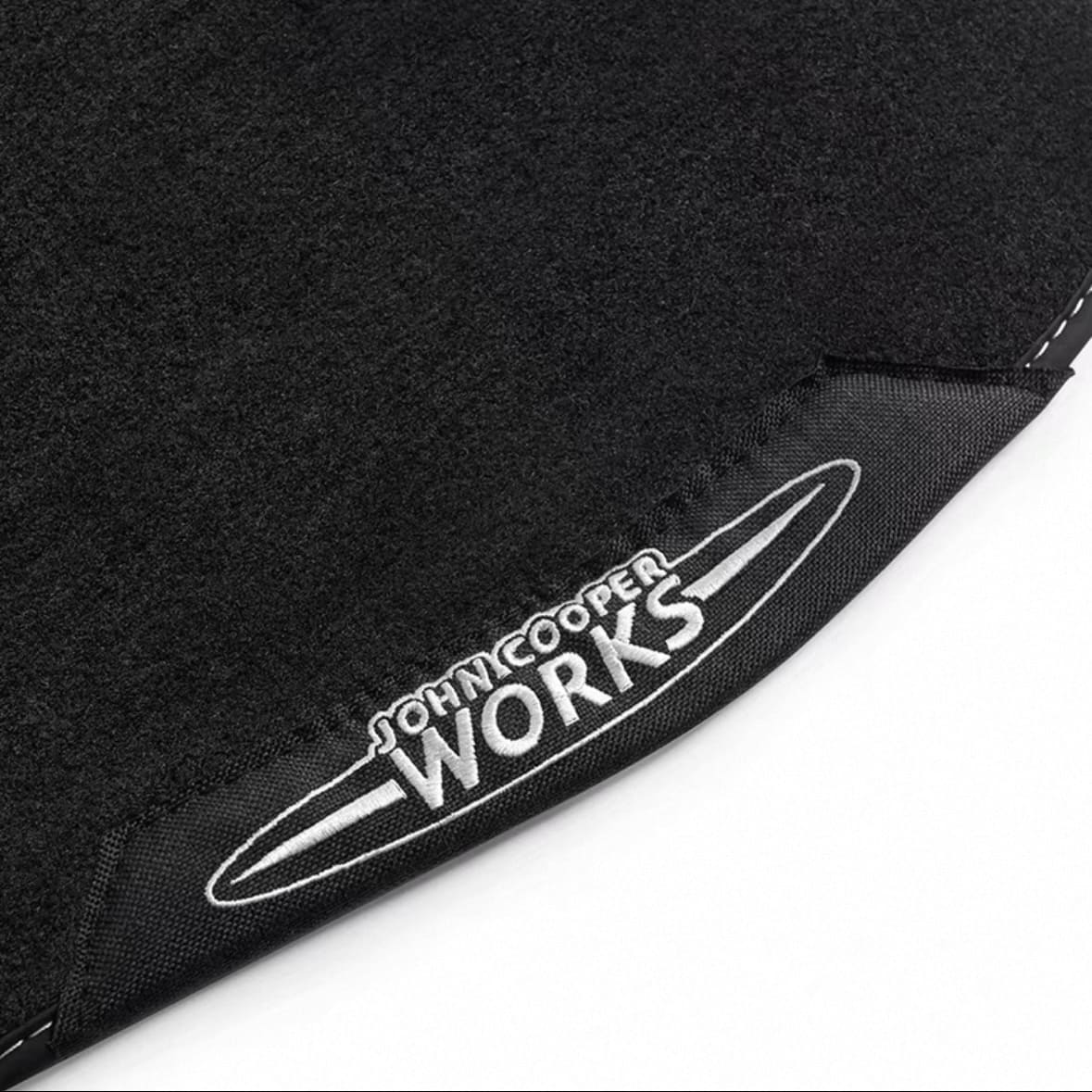 Close-up of JCW embroidery on MINI Cooper velour floor mats