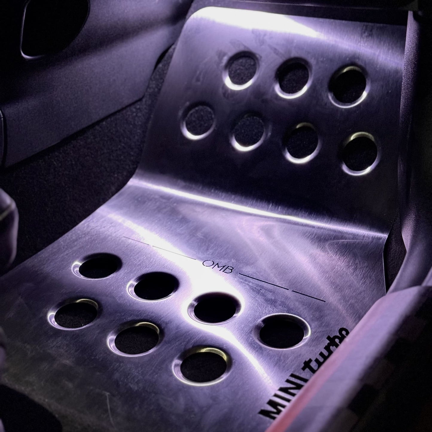 aluminum Stainless steel track mat installed in passenger side footwell of MINI Cooper R56 interior
