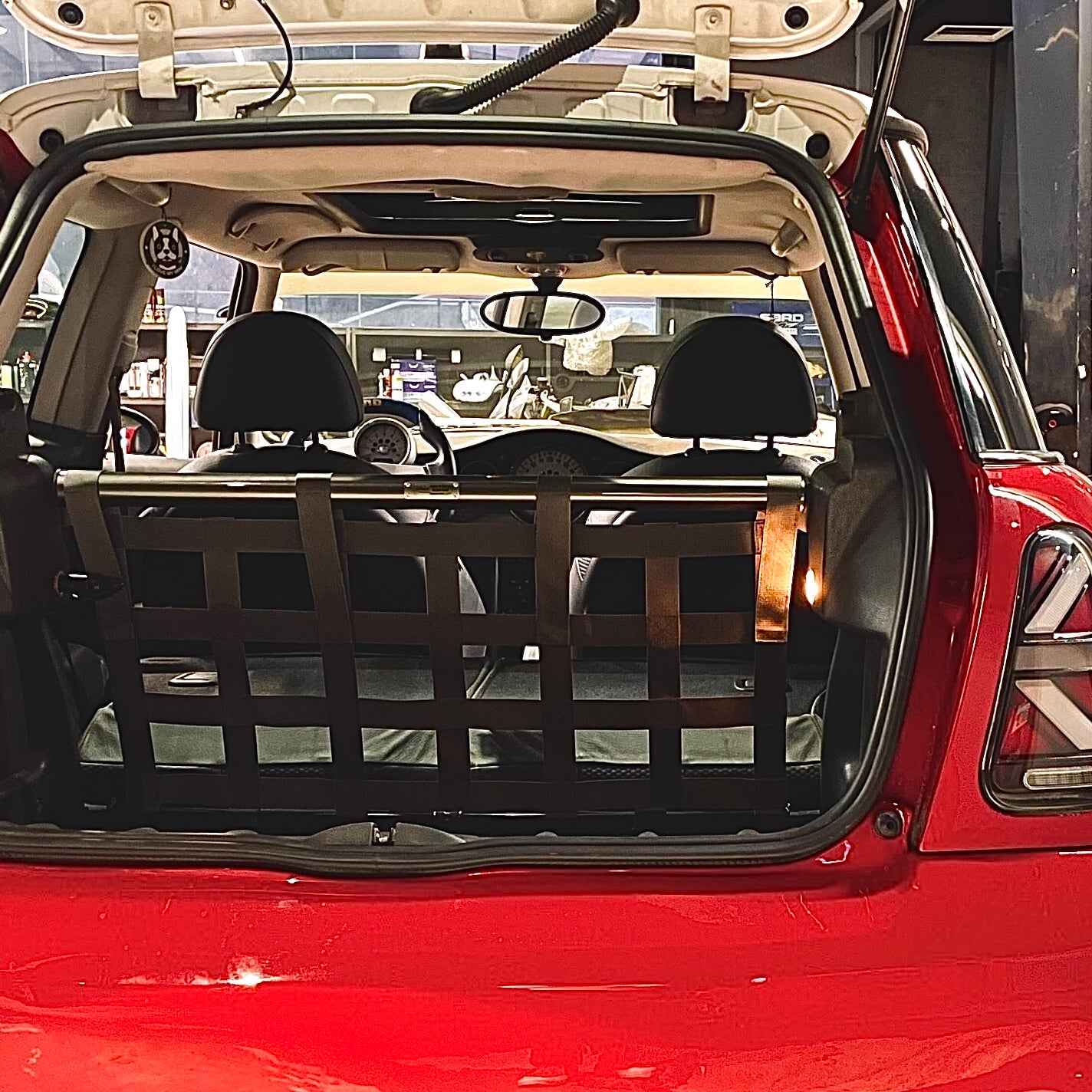 Close-up of the locking mechanism on the MINI Cooper rear strut brace, highlighting triangular surface connection.