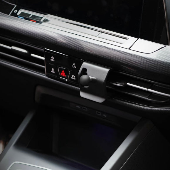 OEM-style OneMiniBite Golf MK8 dashboard phone mount installed in Volkswagen Golf GTI