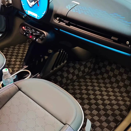 Custom checkered floor mats for 2025 MINI Cooper J01 and F66, showcasing precise fitment in the front row.