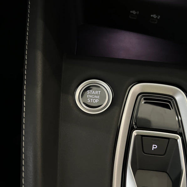 Audi A3 S3 RS3 8Y5 Unibody console cover close-up, hand stitching detail — leather over factory piano black trim