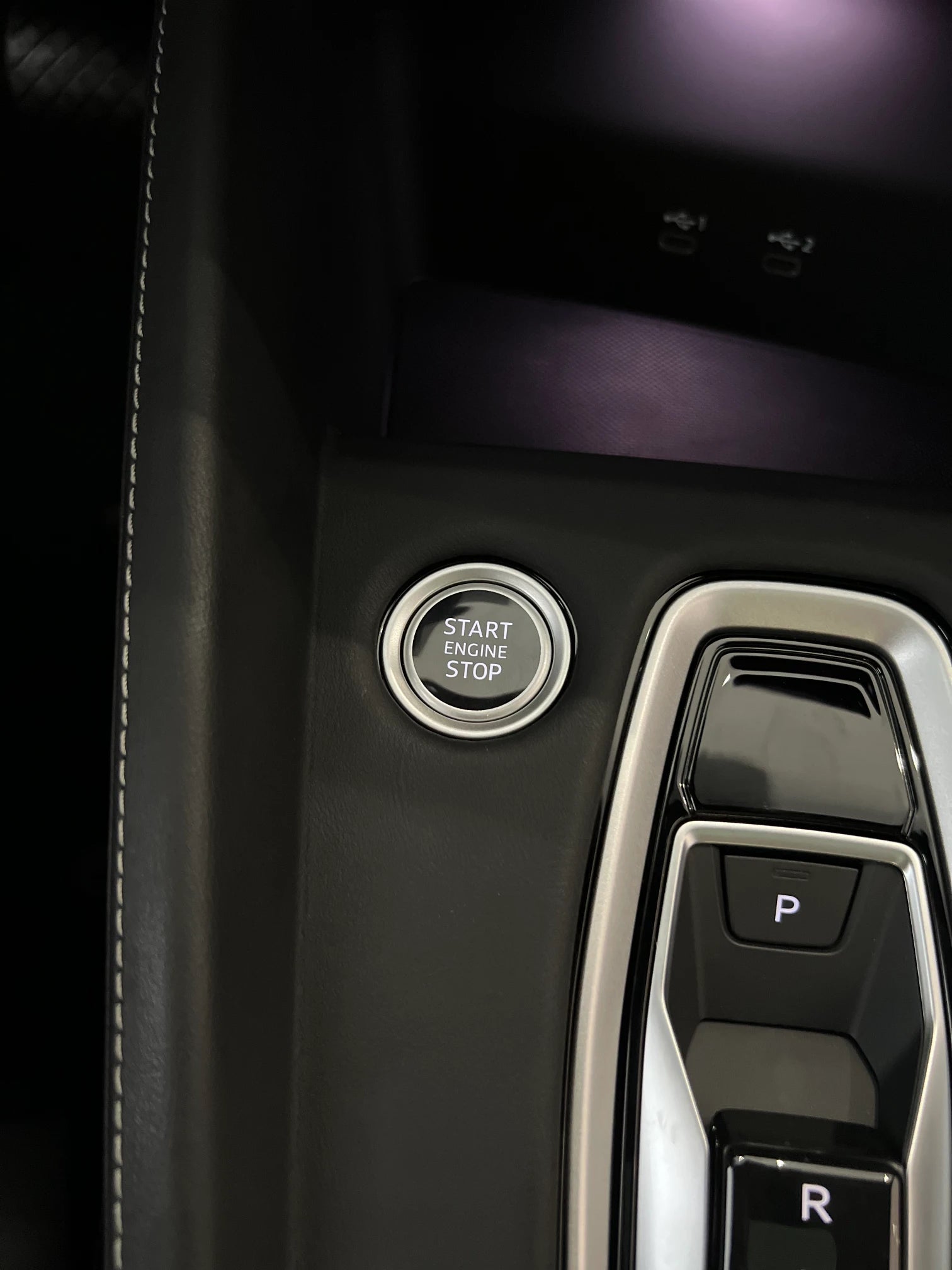 Audi A3 S3 RS3 8Y5 Unibody console cover close-up, hand stitching detail — leather over factory piano black trim
