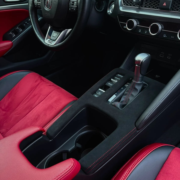 Acura Integra DE4 CVT Alcantara console cover installed, passenger-side view — piano black covered, red stitch 2023 2024 2025