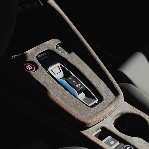Audi A3 S3 RS3 8Y Alcantara unibody console cover with red stitching, shown in daylight