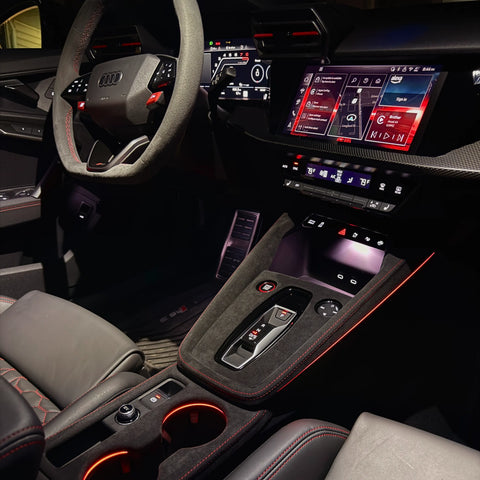 Audi A3 S3 RS3 8Y Alcantara unibody console cover with red stitching, shown at night