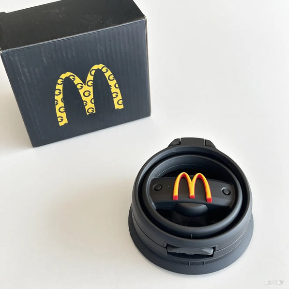 Black arch design cup holder mounted on side of Mini Cooper R60