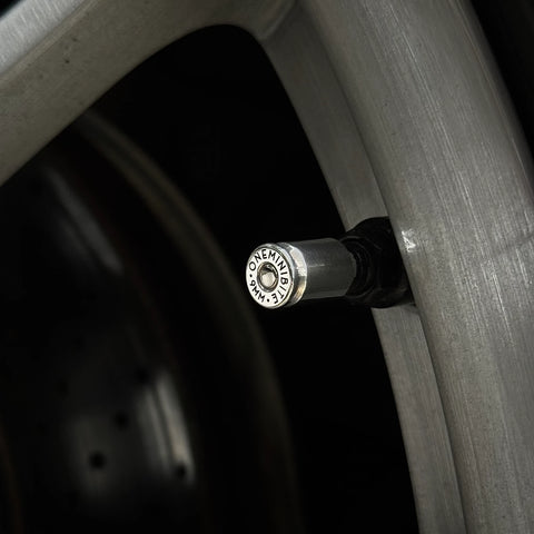 Bullet valve cap chrome finish installed on Porsche wheel rim detail