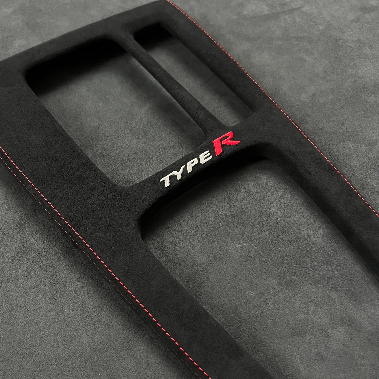 Close-up of Civic Type R FL5 Alcantara console wrap, fully reversible and tailored for LHD & RHD interiors, highlighting premium craftsmanship.