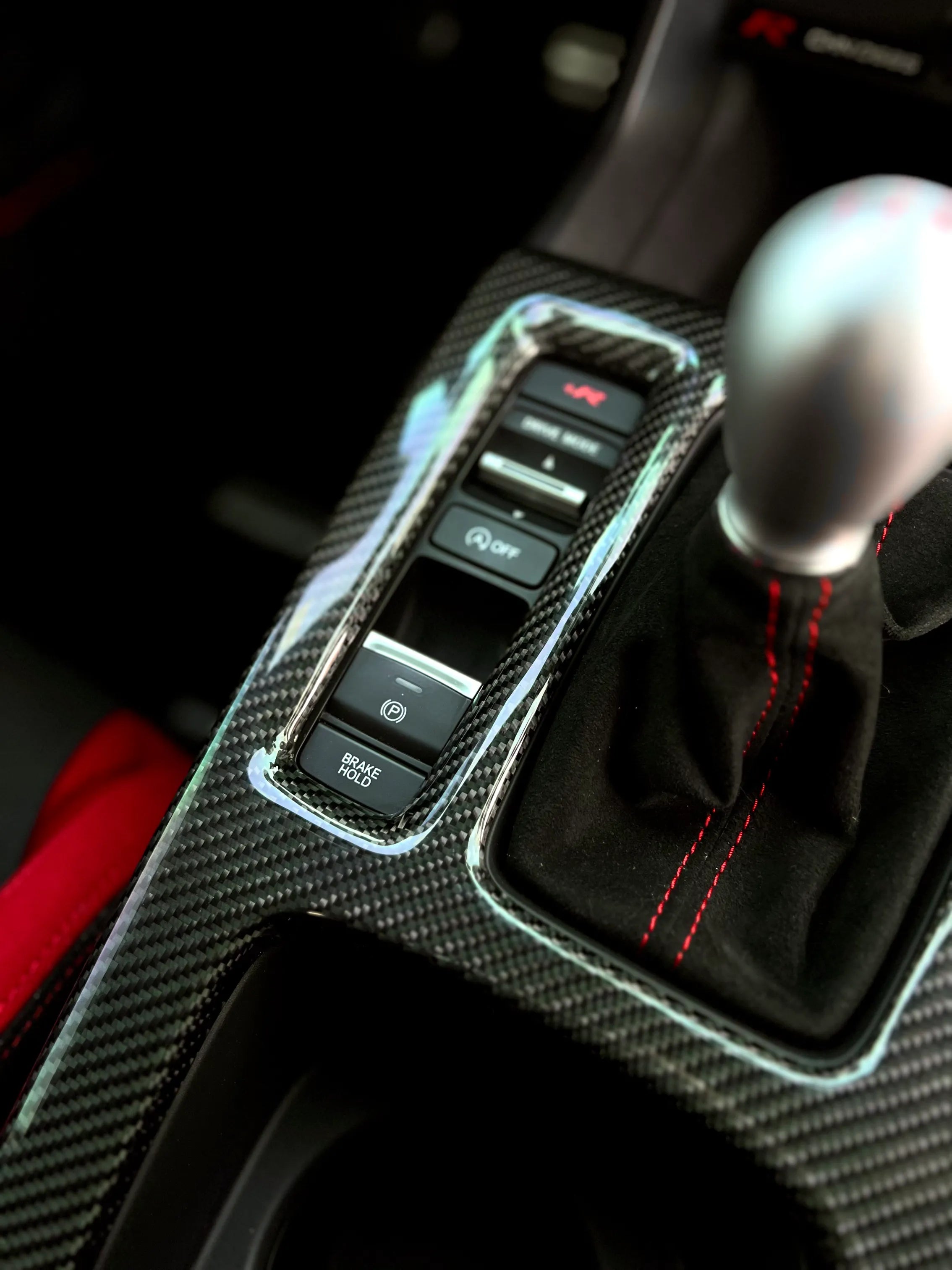 Gloss carbon center console shift panel cover for Honda Civic Type R FL5, direct overlay installation with factory-aligned fit for LHD and RHD manual models.