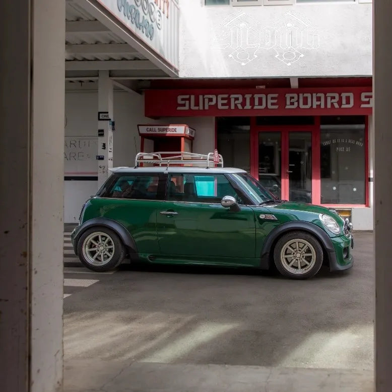 Classic MINI roof rack highlighting wood craftsmanship and stainless steel hardware.