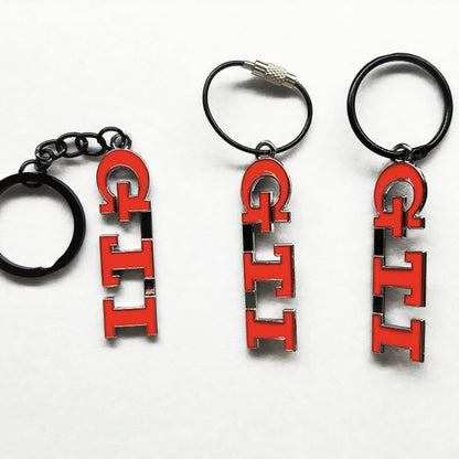 Detailed close-up of the Volkswagen Golf GTI keychain with hand-drawn artwork of all GTI generations, ideal for VW enthusiasts.