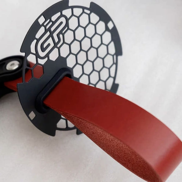 Close-up of high-quality stitching on red leather RS handle pull strap for MINI Cooper.