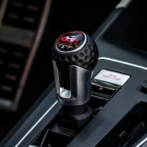 Step-by-step installation of VW Golf MK8 GTI gear knob extension using trim tools