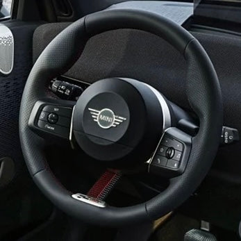 Premium Alcantara airbag cover for MINI Cooper F66 and F67 models, featuring self-adhesive backing and bold JCW racing look.