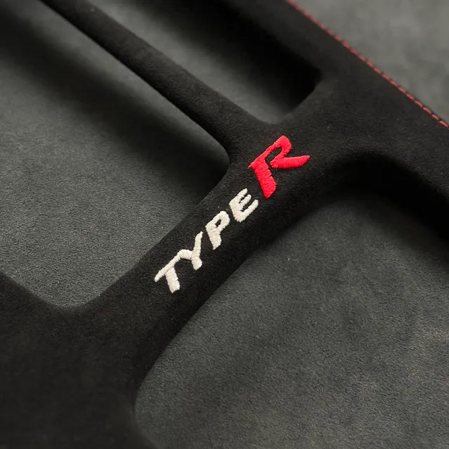 FL5 Civic Type R Alcantara-wrapped center console close-up showing soft-touch material, precision stitching, and LHD & RHD compatibility.