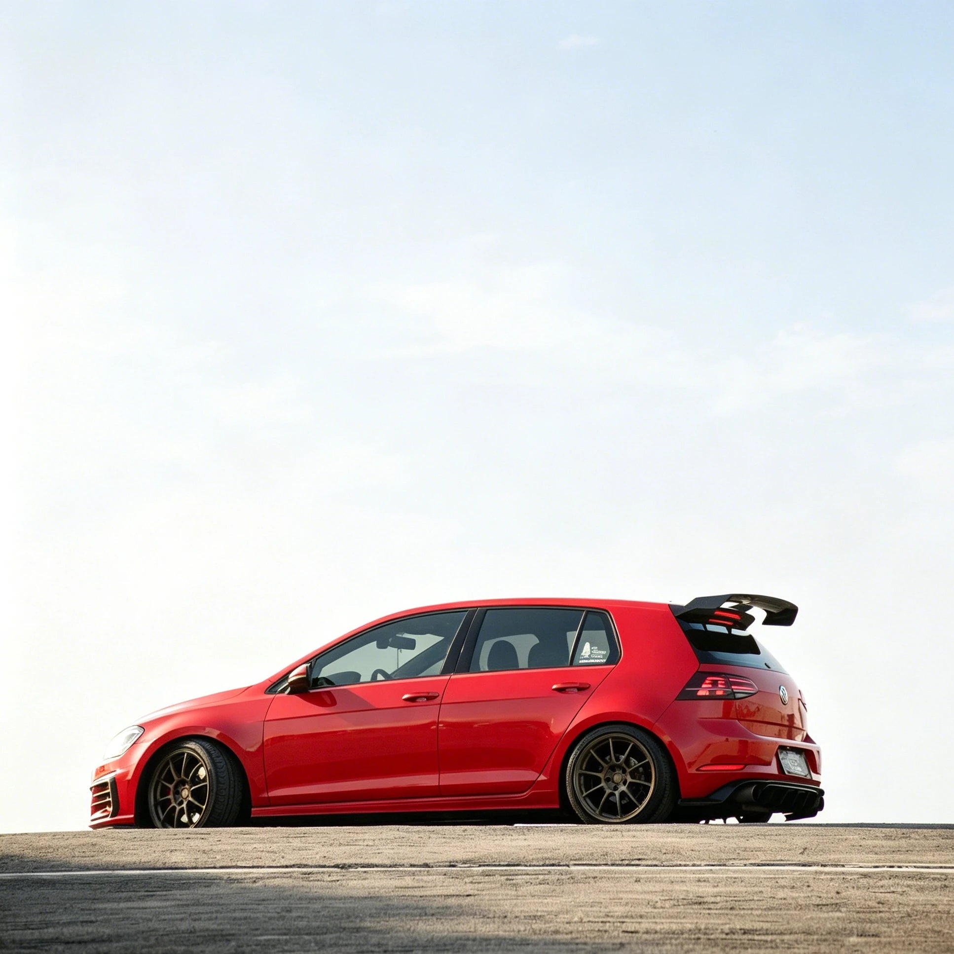 Volkswagen Golf MK7 GTI with OneMiniBite rear spoiler viewed from the rear on the road