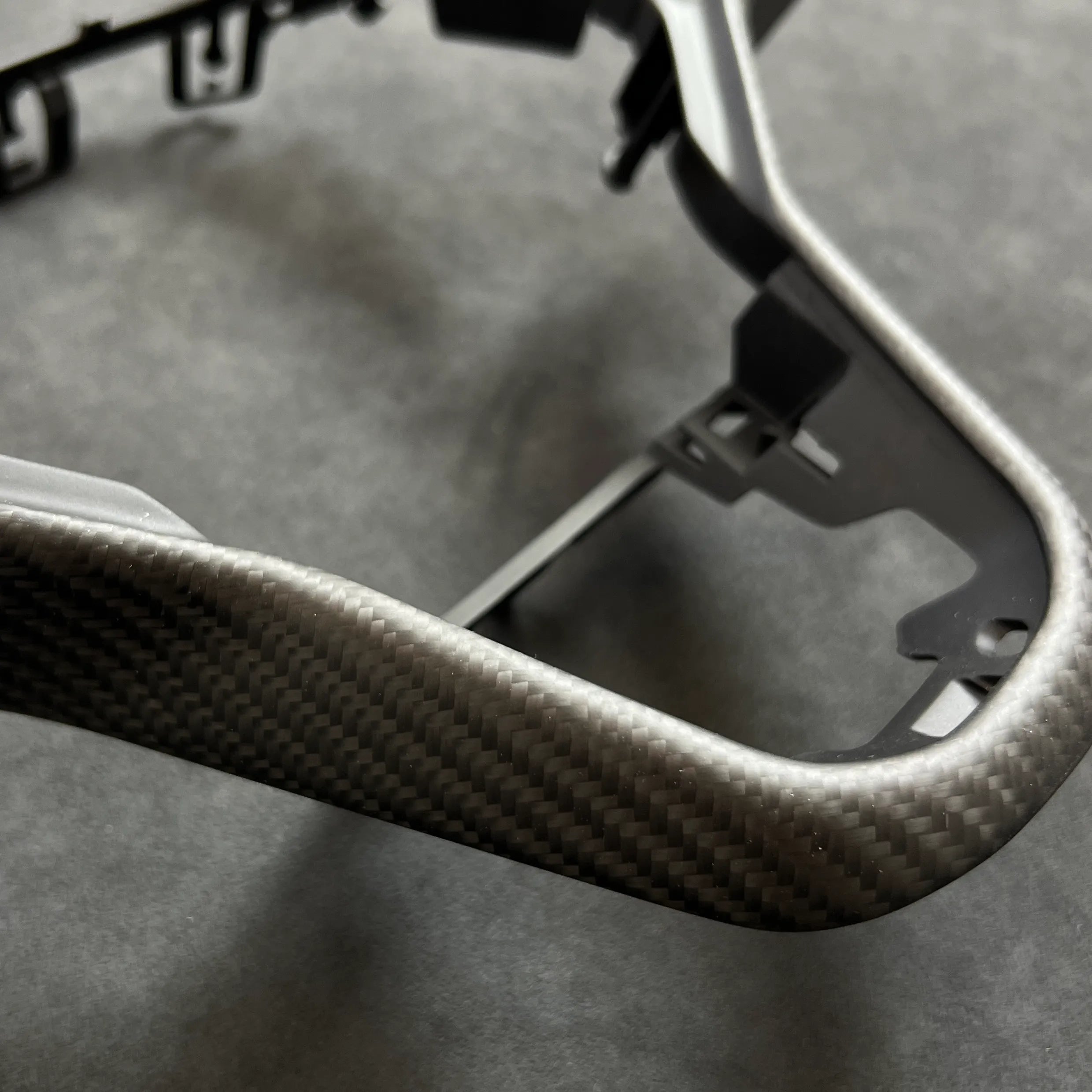 Carbon fiber trim designed for VW Golf MK8 haptic-control steering wheels, delivering OEM-fit precision and a sleek interior enhancement.