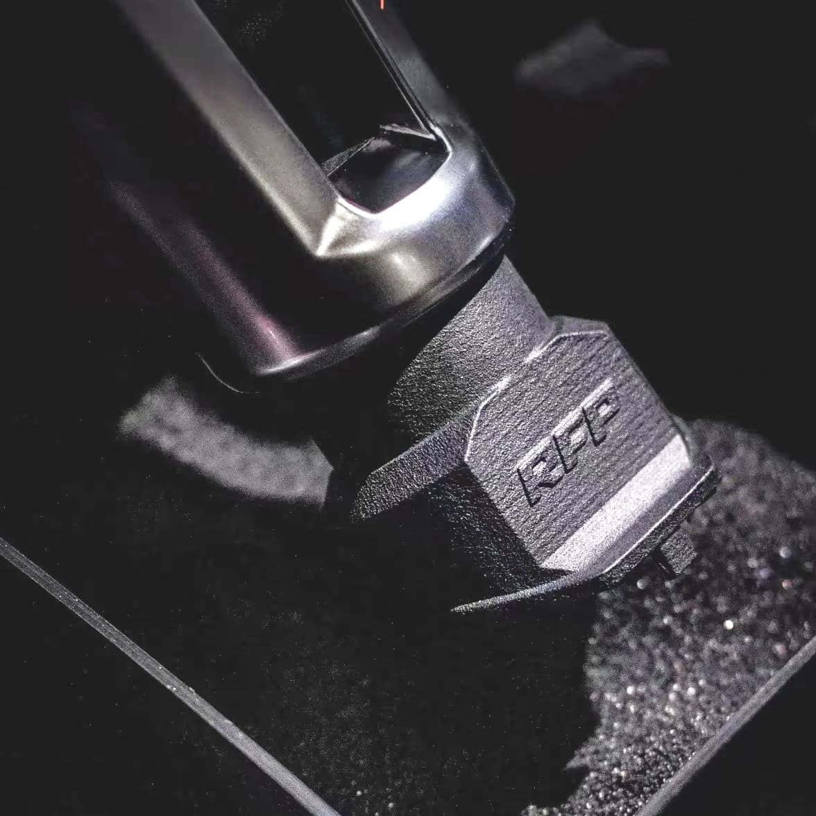 Close-up view of installed shift knob upgrade in Golf MK8
