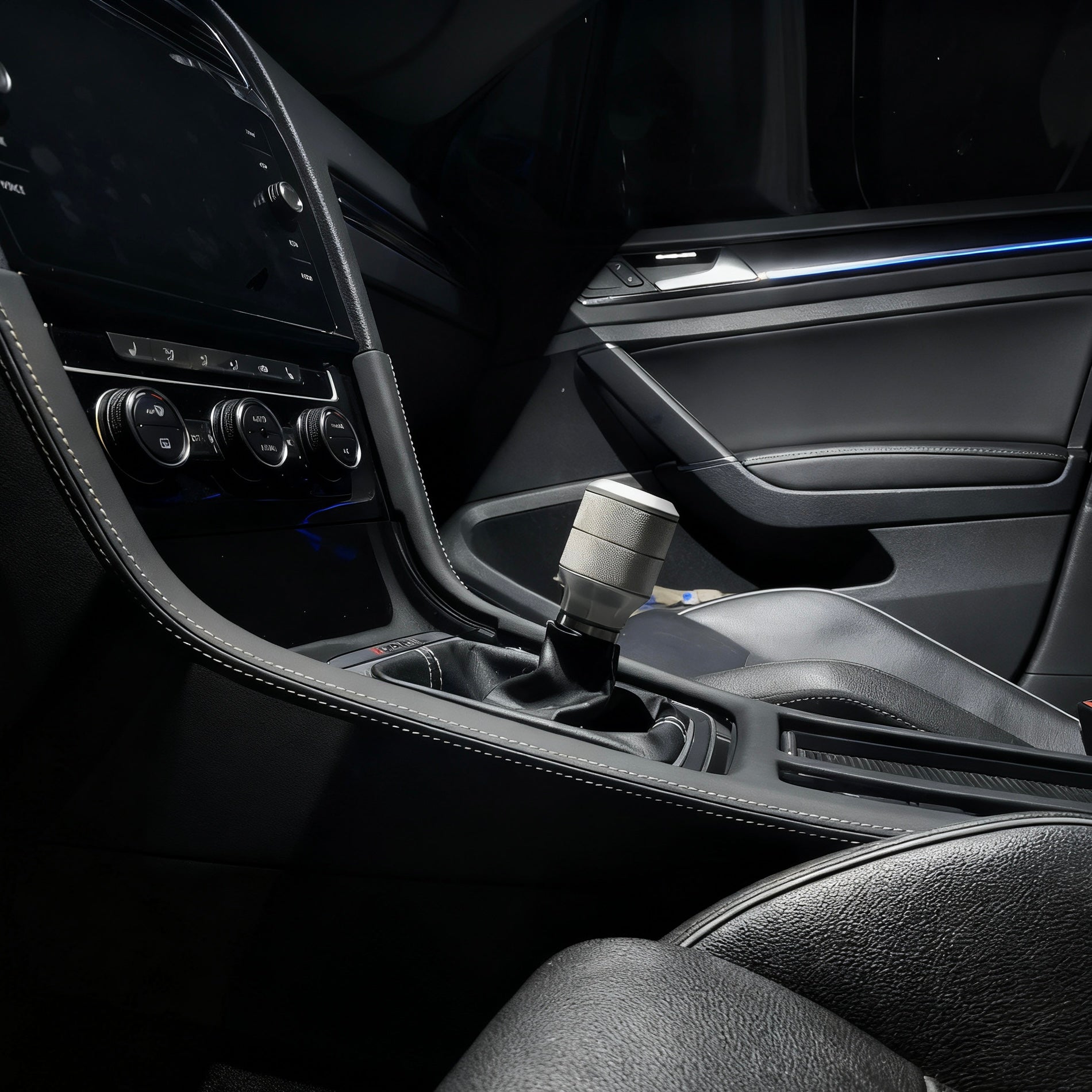 Golf R MK7.5 central console showing precise fitment of the custom Alcantara gear shift panel cover for automatic and manual e-brake models.