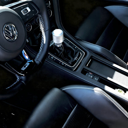 Artisan-crafted VW Golf R MK7 / MK7.5 gear shift panel cover handmade in Alcantara with blue stitching, designed for OEM-quality interior upgrade.