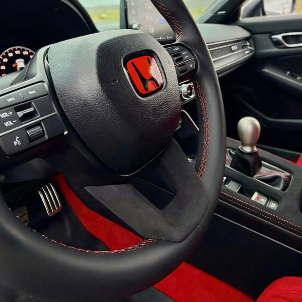 Alcantara steering wheel lower trim installed on Honda Civic FL5 Type R, replacing OEM plastic with factory-style suede interior upgrade