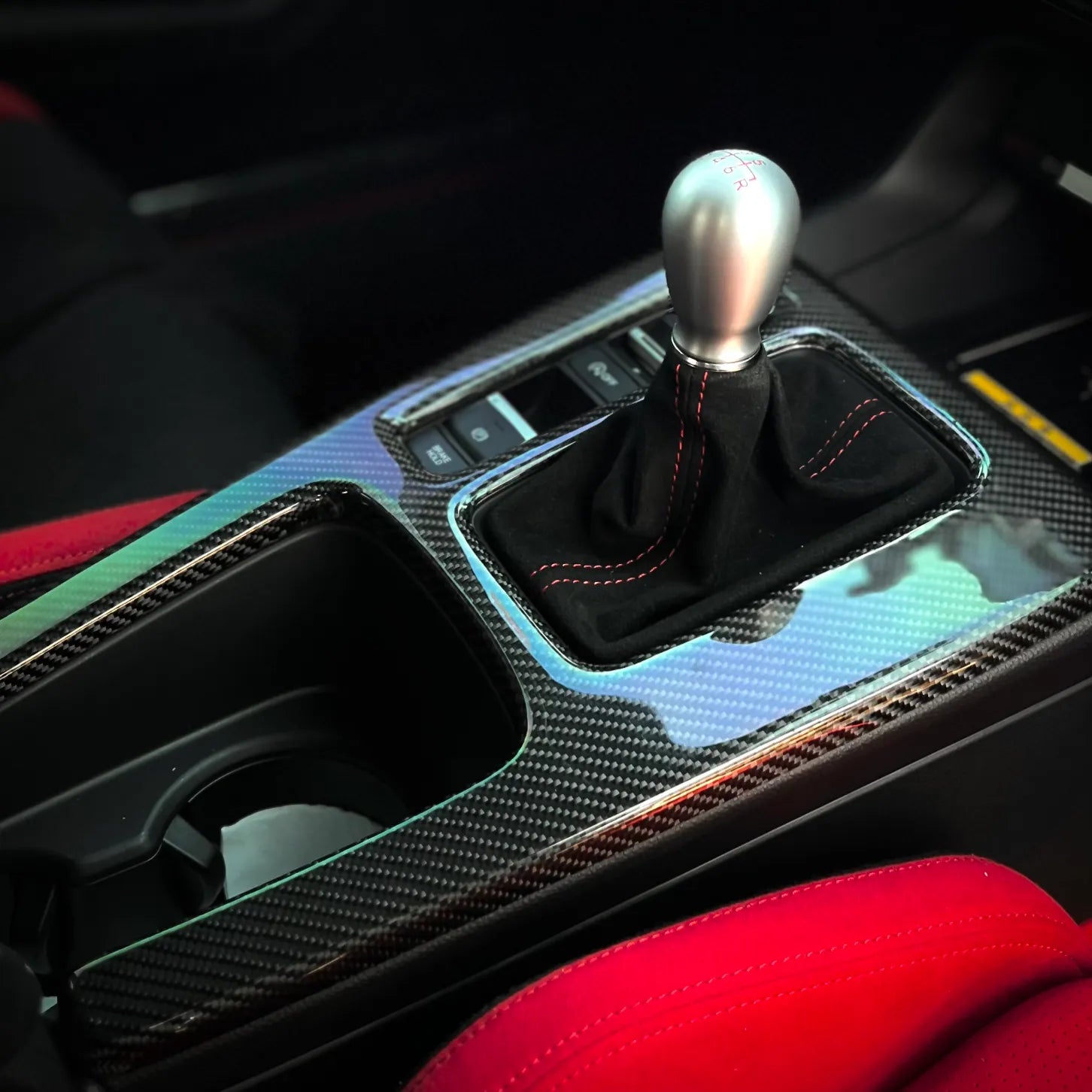 Carbon center console shift panel cover installed on Honda Civic Type R FL5 manual interior, featuring twin stitch lines and OEM-fit overlay design.