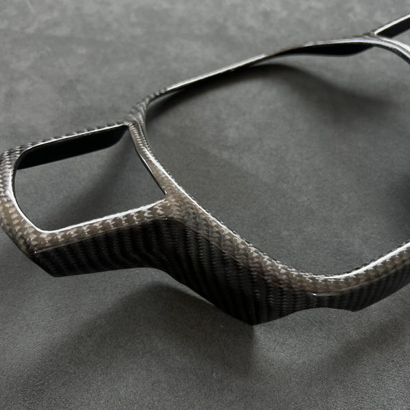 Close-up of Honda Civic FL5 carbon fiber steering wheel trim, semi coverage gloss weave detail, airbag surround finish