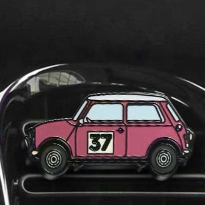 Blush pink air freshener installed in a MINI Cooper, offering a soft and stylish accent.