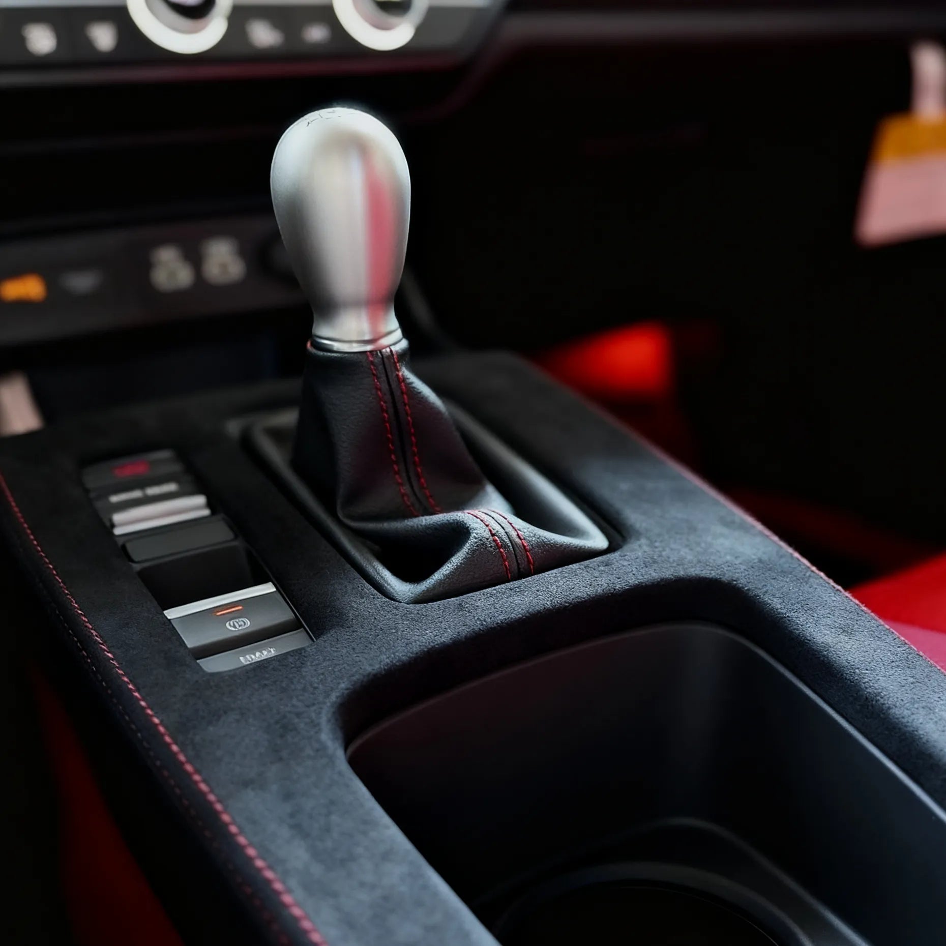 Installed Honda Civic Type R FL5 Alcantara center console cover showing perfect OEM fit, red stitching, and motorsport-inspired design for manual transmission models.