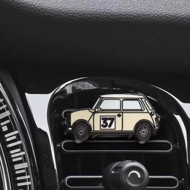 Beige Morris Cooper No. 37 air freshener installed on a MINI Cooper air vent, showcasing its seamless fit.