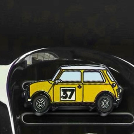 Sunshine yellow air freshener installed in a MINI Cooper, adding a vibrant pop of color.