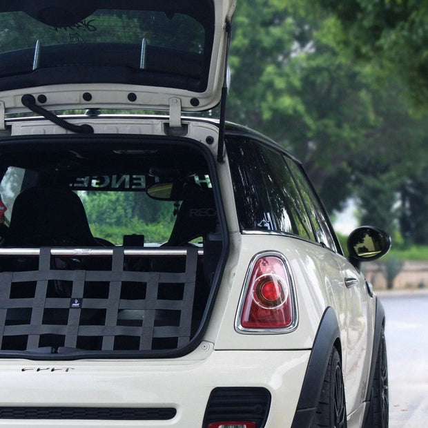 Gun metal cargo racing net installed in a MINI Cooper R53, adding a sporty and functional touch to the interior.