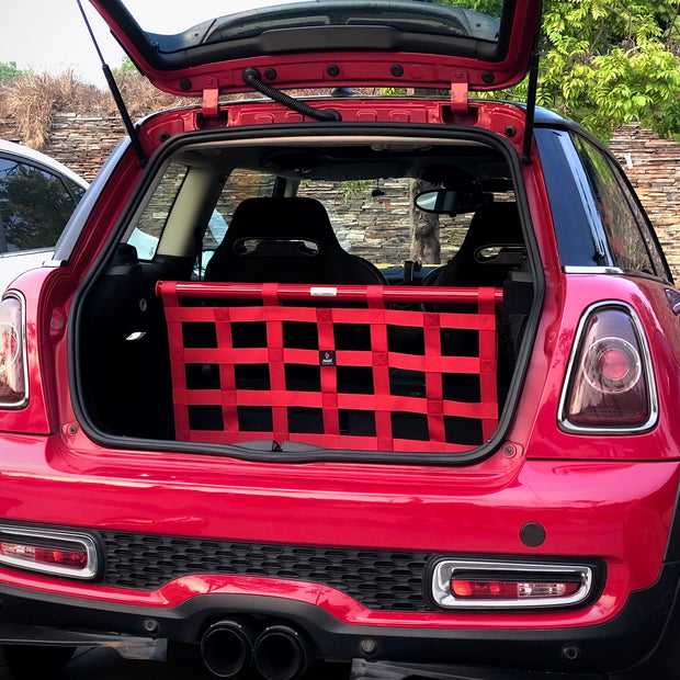 Rear view of the MINI Cooper cargo racing net installed, demonstrating its secure fit and smart storage capabilities.