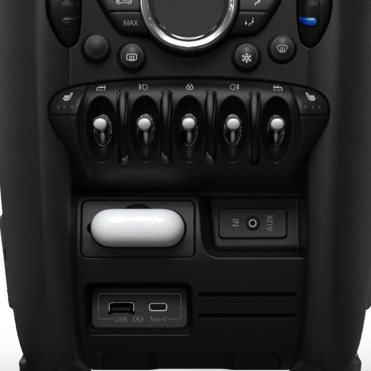 Front view of the MINI Cooper charging compartment, showcasing its sleek design and AirPods slot.