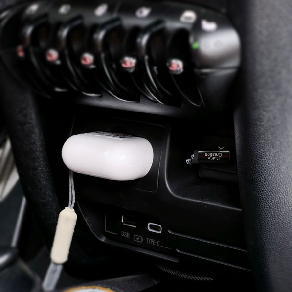 Side view of the MINI Cooper charging compartment, highlighting its compact and easy-to-install design.